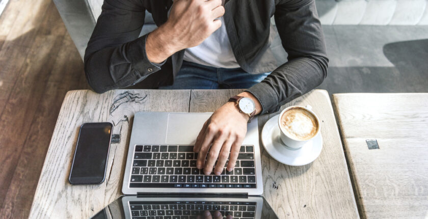 businessman in front of a laptop