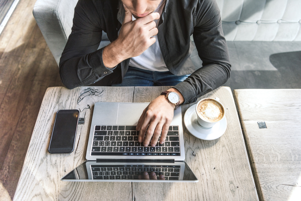 businessman in front of a laptop